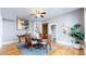 Elegant dining room with hardwood floors, a decorative ceiling fan, and a classic wooden dining set at 2227 N Ogden St, Denver, CO 80205