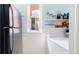Kitchen pantry area offers ample storage space with open shelving and a convenient layout at 2227 N Ogden St, Denver, CO 80205