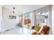 Bright sunroom with sliding glass doors that lead to a fenced backyard at 2227 N Ogden St, Denver, CO 80205