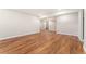 Spacious basement featuring hardwood floors and neutral walls, offering a versatile living area at 10003 Atlanta St, Parker, CO 80134