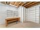 Unfinished basement area with shelving, exposed ceiling and concrete flooring at 10003 Atlanta St, Parker, CO 80134