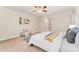 Bright bedroom featuring carpet floors, a ceiling fan, and modern art on the walls at 10003 Atlanta St, Parker, CO 80134