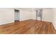 Spacious bedroom featuring light walls, wood-look flooring and a window with gray drapes at 10003 Atlanta St, Parker, CO 80134