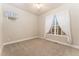Bedroom with neutral carpet, ceiling fan, and bright natural light at 10003 Atlanta St, Parker, CO 80134