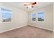 Empty bedroom featuring plush carpets and bright, natural light at 10003 Atlanta St, Parker, CO 80134