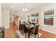 Formal dining room with seating for six, wood floors, and a view of the backyard at 10003 Atlanta St, Parker, CO 80134