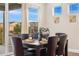 A cozy dining area featuring sliding glass doors to the patio and great natural light at 10003 Atlanta St, Parker, CO 80134