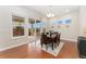 Dining room with hardwood floors, sliding glass door, and modern chandelier at 10003 Atlanta St, Parker, CO 80134