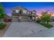 Charming two-story home with a three car garage and stone accents at 10003 Atlanta St, Parker, CO 80134