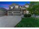 Charming two-story home with a three car garage and manicured lawn at 10003 Atlanta St, Parker, CO 80134