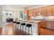 Eat-in kitchen with island, granite counters, stainless steel appliances, and hardwood floors at 10003 Atlanta St, Parker, CO 80134