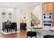 Open floor plan with kitchen, dining area, and a view of the staircase at 10003 Atlanta St, Parker, CO 80134
