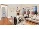 Bright living room featuring a fireplace, large windows, and comfortable seating at 10003 Atlanta St, Parker, CO 80134