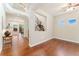 Sun-filled living room boasts hardwood floors, an open floor plan, and large windows at 10003 Atlanta St, Parker, CO 80134