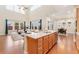 Open concept living room with large windows, natural light, and eat-in kitchen at 10003 Atlanta St, Parker, CO 80134