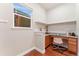 Home office with granite countertops and built-in shelves at 10003 Atlanta St, Parker, CO 80134