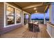 Inviting covered patio with stylish outdoor dining set, offering peaceful exterior views at 14111 Blue Stem St, Broomfield, CO 80020