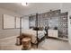 Stylishly designed bedroom with a canopy bed, patterned wallpaper, and coordinated decor elements at 14111 Blue Stem St, Broomfield, CO 80020