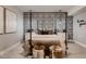 Guest bedroom features a statement wall, canopy bed, and neutral color palette at 14111 Blue Stem St, Broomfield, CO 80020