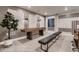 Recreational room featuring a shuffleboard table and decorative wall art, complemented by comfortable seating at 14111 Blue Stem St, Broomfield, CO 80020