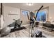 Home gym equipped with exercise machines and a dedicated workspace, enhanced by natural light at 14111 Blue Stem St, Broomfield, CO 80020