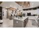 Open kitchen with a large center island, modern appliances, and views to the living area at 14111 Blue Stem St, Broomfield, CO 80020