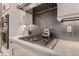 Close up of a kitchen with stainless steel appliances, a gas stovetop, and sleek cabinetry at 14111 Blue Stem St, Broomfield, CO 80020