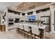 Spacious kitchen featuring a large center island, sleek appliances, and contemporary pendant lighting at 14111 Blue Stem St, Broomfield, CO 80020