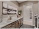 Functional laundry room with ample counter space, sleek cabinetry, and modern appliances at 14111 Blue Stem St, Broomfield, CO 80020