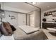 Tranquil main bedroom featuring a four-poster bed, modern decor, and a serene color palette at 14111 Blue Stem St, Broomfield, CO 80020