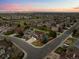 Picturesque neighborhood showcasing the subject house and expansive mountain views at 10103 Knoll Cir, Highlands Ranch, CO 80130