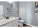 Stylish powder room featuring a modern sink and decorative wall accents at 10103 Knoll Cir, Highlands Ranch, CO 80130