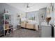Comfortable bedroom bathed in natural light, featuring a ceiling fan and tasteful decor throughout at 10103 Knoll Cir, Highlands Ranch, CO 80130