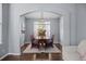 Elegant dining room featuring a large wooden table and natural light at 10103 Knoll Cir, Highlands Ranch, CO 80130