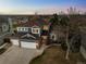 Beautiful two-story home with a three-car garage situated on a landscaped lot at 10103 Knoll Cir, Highlands Ranch, CO 80130