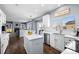 Modern kitchen with stainless steel appliances, island and connected living area at 10103 Knoll Cir, Highlands Ranch, CO 80130