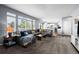 Open-concept living room with large windows and a comfortable sectional sofa at 10103 Knoll Cir, Highlands Ranch, CO 80130