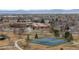 This aerial view highlights the community tennis courts, school and park at 12550 Maria Cir, Broomfield, CO 80020