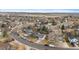 Aerial view of the neighborhood with a house in the foreground and plains in the distance at 12550 Maria Cir, Broomfield, CO 80020