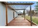 Wooden deck with pergola, and an exterior view of a fenced yard with a small storage shed at 12550 Maria Cir, Broomfield, CO 80020