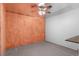 Unfinished basement features painted walls, concrete floor, and overhead ceiling fan at 12550 Maria Cir, Broomfield, CO 80020