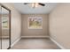 Comfortable bedroom featuring a ceiling fan and large window at 12550 Maria Cir, Broomfield, CO 80020