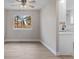 Sunlit dining area featuring neutral paint, wood floors, a ceiling fan, and an adjacent kitchen at 12550 Maria Cir, Broomfield, CO 80020