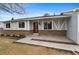 Attractive home showcasing light blue siding, brick accents, and a well-manicured lawn with trees at 12550 Maria Cir, Broomfield, CO 80020