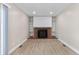 Bright living room featuring a brick fireplace and built-in shelving on either side at 12550 Maria Cir, Broomfield, CO 80020