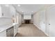 Bright open concept living space featuring recessed lighting, a brick fireplace, and white built-in shelving at 12550 Maria Cir, Broomfield, CO 80020
