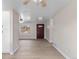 Bright living room boasts wood floors, neutral walls, a ceiling fan, and an entryway at 12550 Maria Cir, Broomfield, CO 80020
