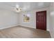 Spacious open-concept living area with wood floors, natural light, and a front door at 12550 Maria Cir, Broomfield, CO 80020