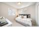 Cozy bedroom with neutral decor, comfortable bedding, and ample natural light at 13616 E 103Rd Pl, Commerce City, CO 80022