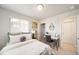 Comfortable bedroom showcasing a work area, closet and natural lighting at 13616 E 103Rd Pl, Commerce City, CO 80022
